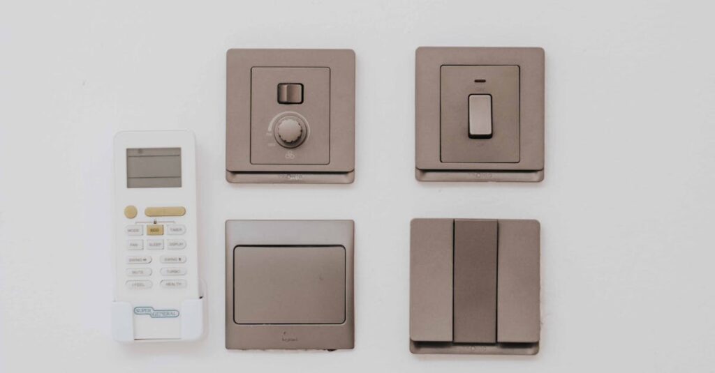 pexels-photo-10117712-10117712-1 A clean, minimalist arrangement of a remote control and four light switches against a white wall.