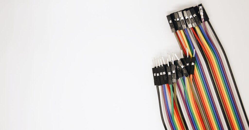 pexels-photo-2332882-2332882 A set of colorful rainbow electrical jumper wires laid out on a white background.
