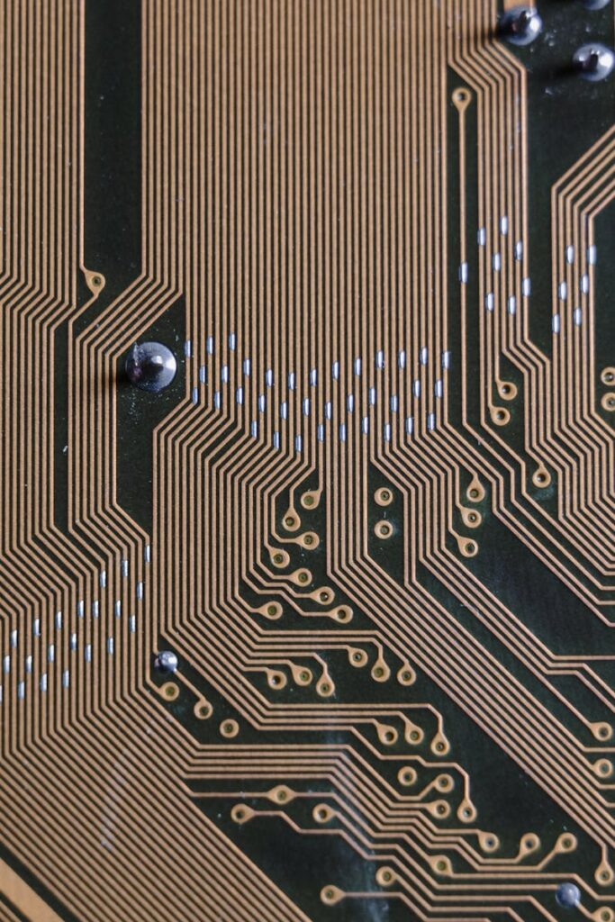 Detailed view of a circuit board with intricate gold traces.